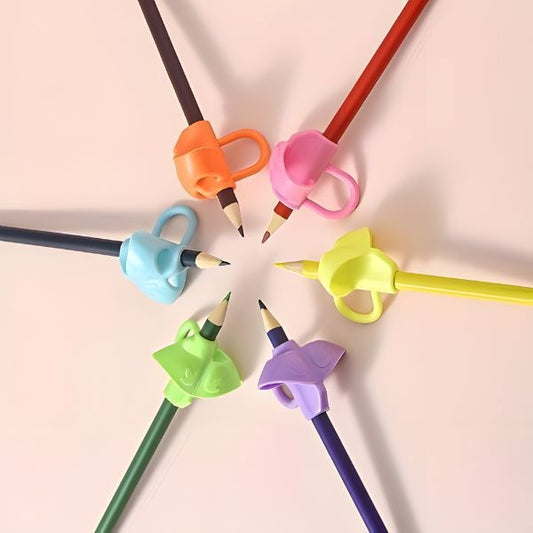 Penngrepp för tre fingrar i flera färger monterade på pennor i cirkelformation