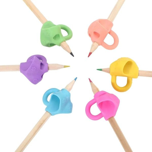 Penngrepp för tre fingrar i flera färger monterade på pennor i cirkelformation