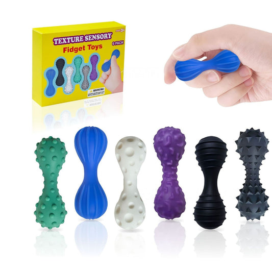 Sex taktila fidgets i dova färger med räfflor, kupor, gropar, ringar och piggar, en hålls i handen.