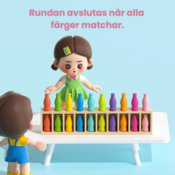 Barn visar slutresultatet i Drink Matching Game när alla färger är matchade i spelbrädan.