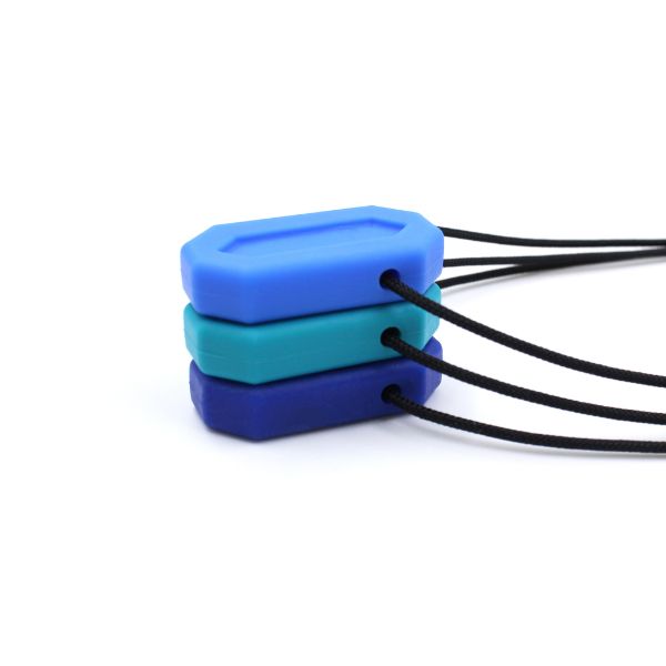 Flera MiniBite staplade för storleksjämförelse, ca 4 cm höga