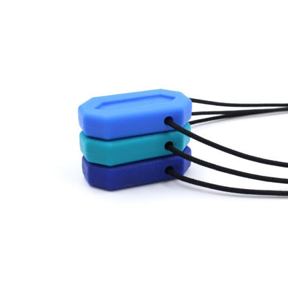 Flera MiniBite staplade för storleksjämförelse, ca 4 cm höga