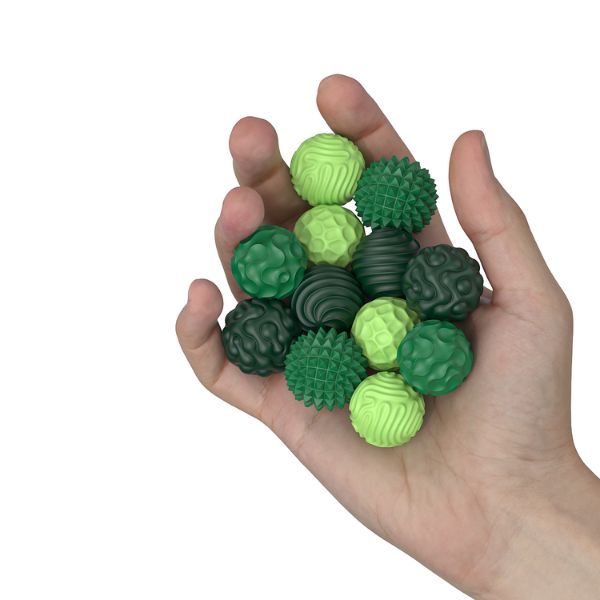 Gröna magnetiska sensoriska fidgetbollar i hand – taktilt hjälpmedel som främjar lugn och koncentration vid ADHD