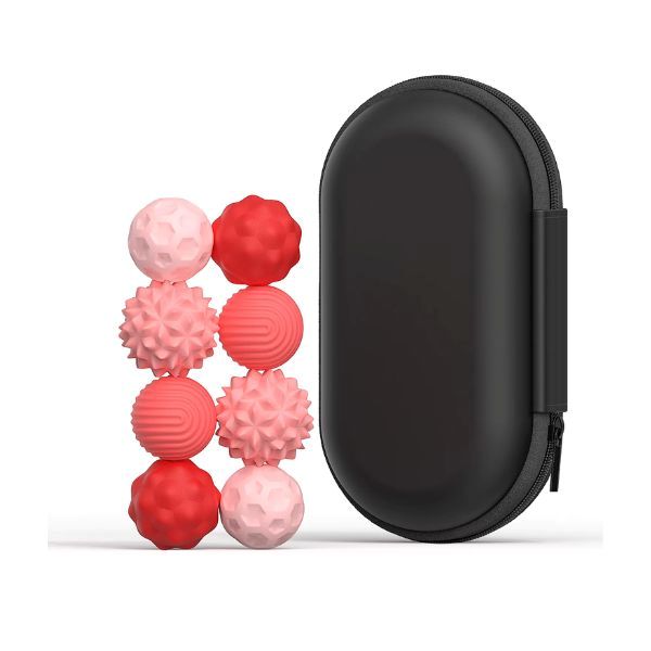 Rosa och röda taktila magnetkulor med svart resefodral. 