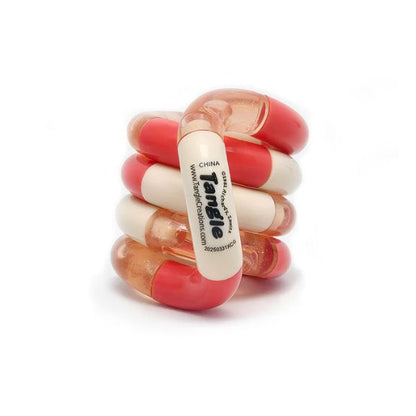 Tangle Jr Classic fidgetleksak rosa och vit NPF hjälpmedel för taktil stimulans och vardagslugn