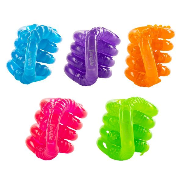 Flera Tangle Jr Glow staplade i olika färger, utformade för lugn och sensorisk stimulans.
