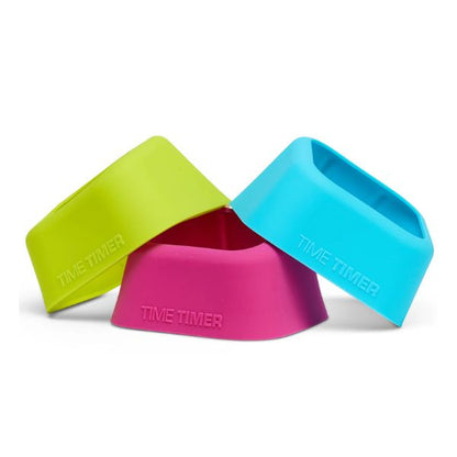 Tre silikonfodral till Time Timer MOD i färgerna limegrön, blå och rosa staplade tillsammans.