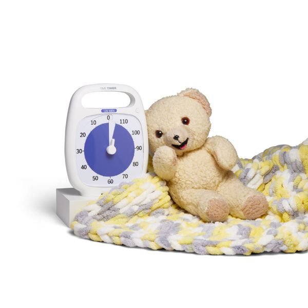 Time Timer PLUS 120 min placerad bredvid nalle och filt – hjälper barn att skapa rutiner