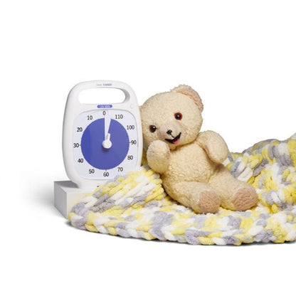 Time Timer PLUS 120 min placerad bredvid nalle och filt – hjälper barn att skapa rutiner