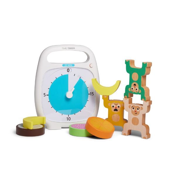 Time Timer PLUS 20 min placerad bredvid färgglada leksaker under aktivitet.