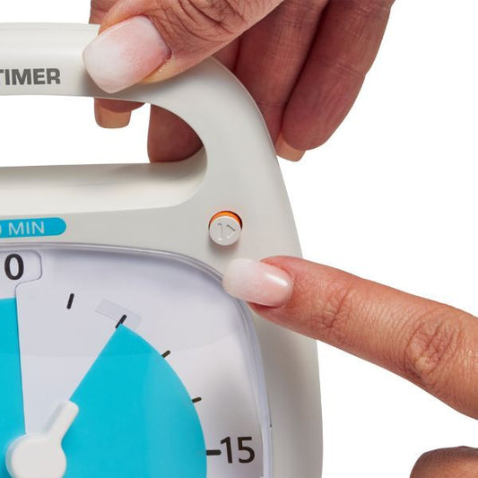 Närbild av Time Timer PLUS 20 min där pausknappen trycks in.