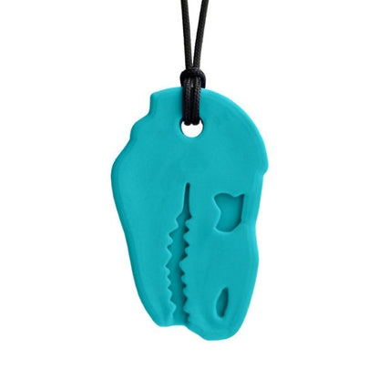 Turkost Dino-Bite tugghalsband i silikon med detaljerad dinosauriedesign.